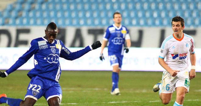 Joey Barton looks to close down Sambou Yatabare