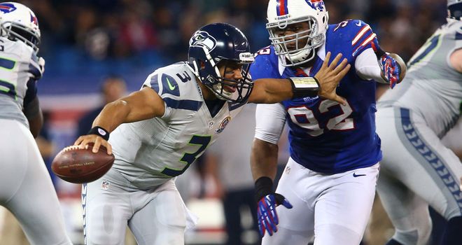Russell Wilson: Ran for three touchdowns and threw for another in Seattle's comfortable win