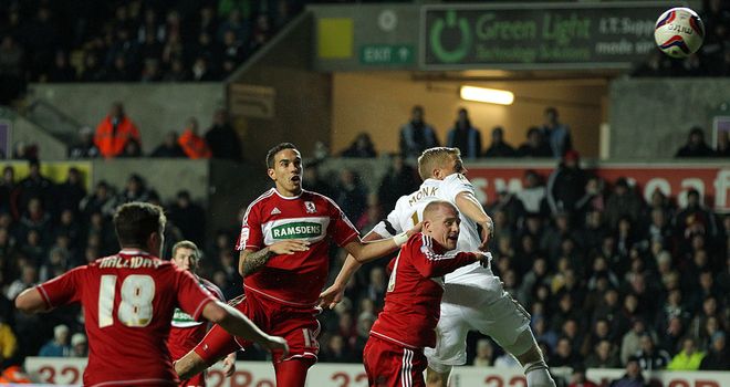 Own goal: Seb Hines is consoled by Richie Smallwood after his own goal gave Swansea victory