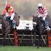 Puffin Billy jumps past Up To Something at the last in the novice hurdle...