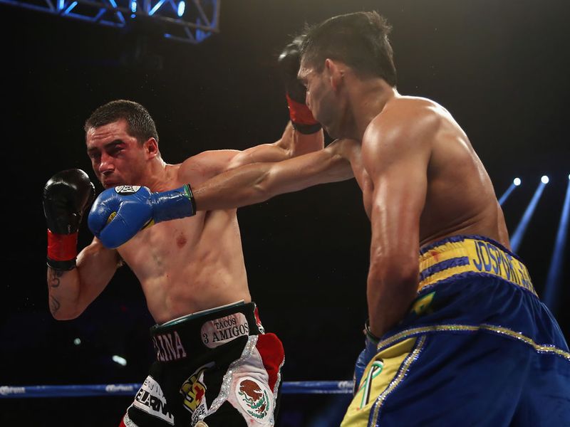 Khan lands a right cross on the way to victory over Molina