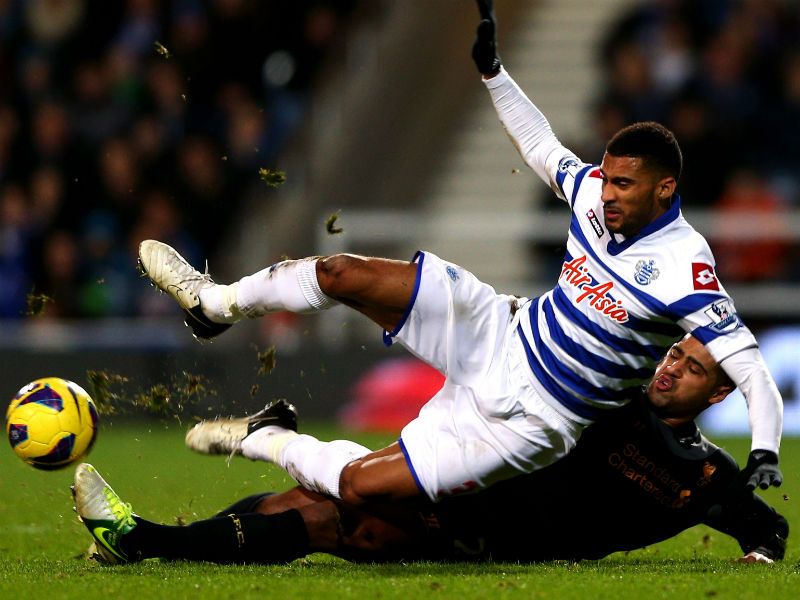 Armand Traore is tackled by Liverpool's Glen Johnson.