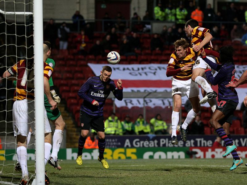 Thomas Vermaelen rescues Arsenal with a header two minutes from time to force extra-time