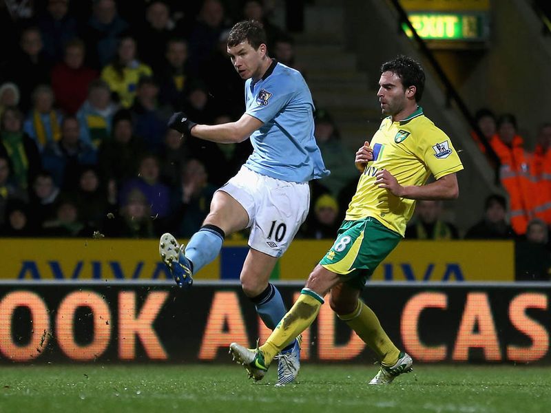 The game at Craven Cottage swings back-and-forth, Edin Dzeko beats the offside trap and fires a shot which hits the post and goes in off Mark Bunn. 4-2.