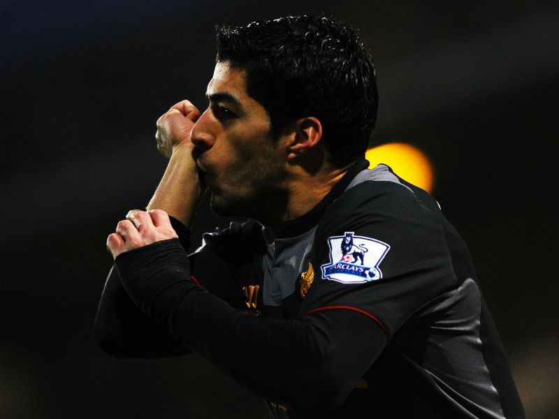Luis Suarez celebrates scoring Liverpool's opener.