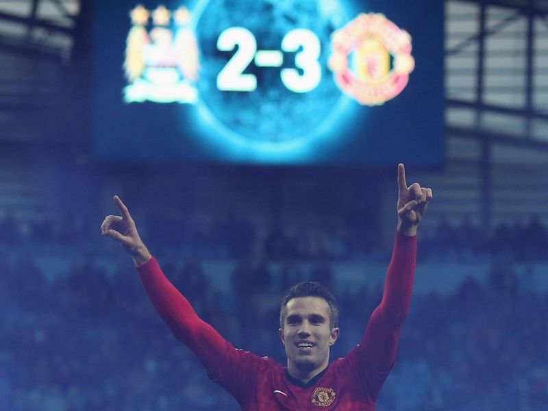 The picture tells the story of Robin van Persie's late Manchester derby winner