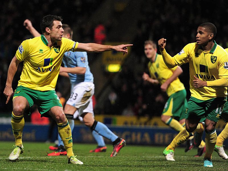 The goals keep coming at Carrow Road as Norwich make it 4-3 when Russell Martin scores his second by diverting a Bradley Johnson shot into the net.