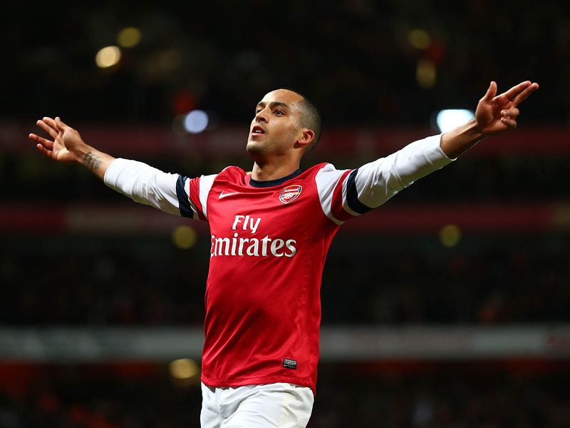 ...and chips the ball past the advancing Tim Krul. Walcott's third comes in the 90th minute and completes a 7-3 victory for The Gunners.