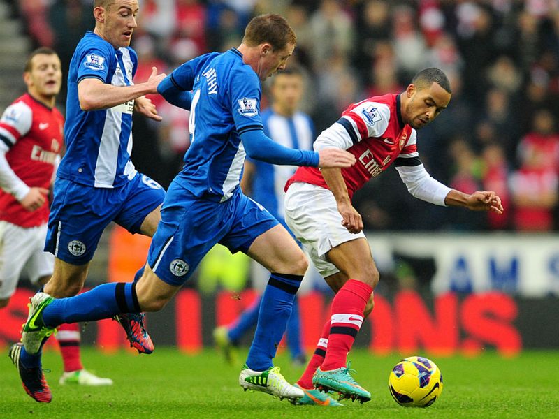 Arsenal's Theo Walcott starts again in his favoured Centre Forward role, while James McCarthy fills in at Centre Back for Wigan.
