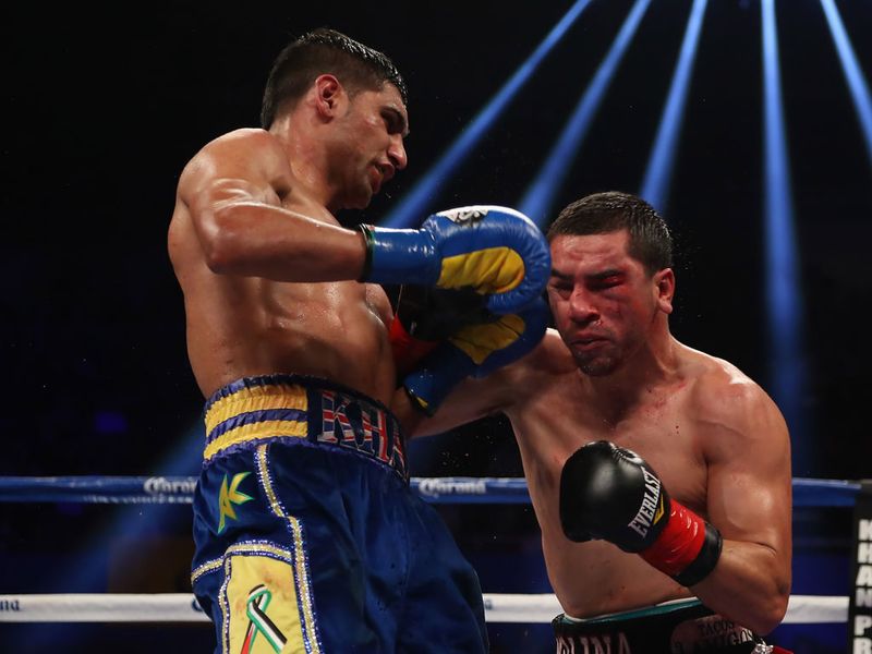 A left hook lands flush but Molina takes it well