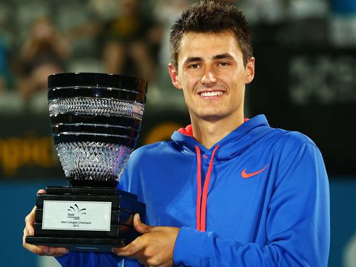Bernard Tomic with the spoils of victory