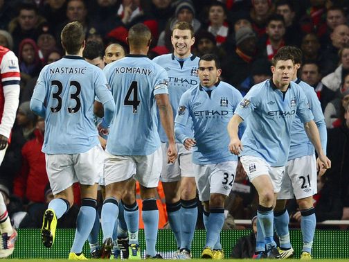 Dzeko celebrates his goal for Man City