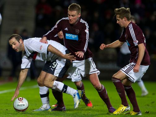 Gary Harkins holds off Ryan Stevenson and Billy King