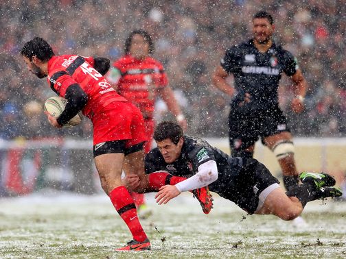 Leicester beat Toulouse in the snow to march on.
