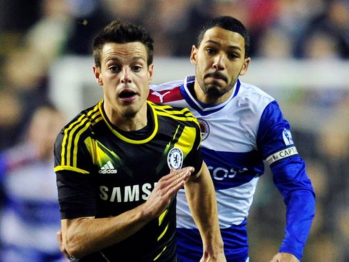 Cesar Azpilicueta tries to get clear of Jobi McAnuff