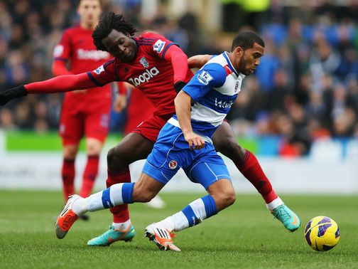 Adrian Mariappa holds off Romelu Lukaku
