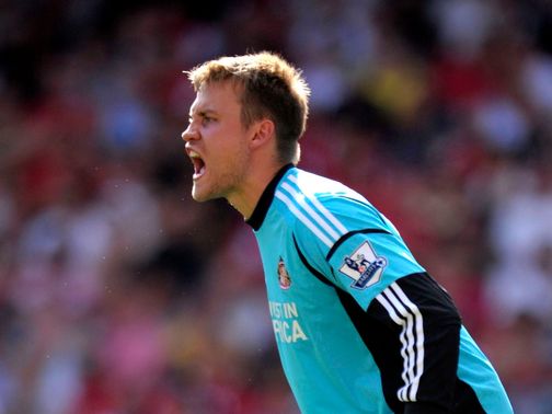 Mignolet is looking upwards rather than over his shoulder
