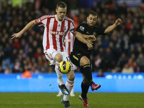 Ryan Shawcross and Shaun Maloney battle for the ball
