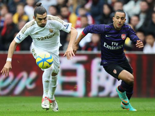 Chico and Theo Walcott battle for the ball