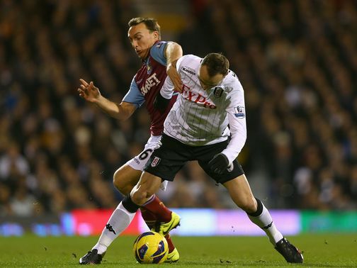 Mark Noble and Dimitar Berbatov tussle at Craven Cottage