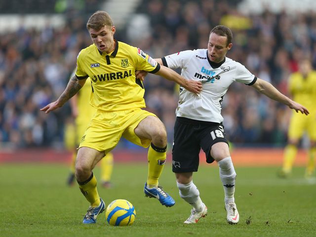 Max Power is tackled by Ben Davies