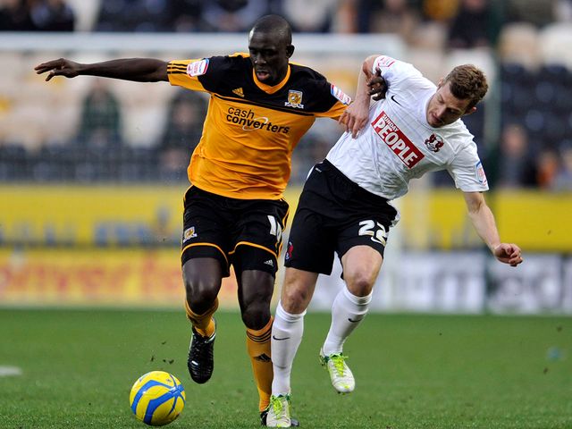 Seyi Olofinjana and Martin Rowlands battle for possession