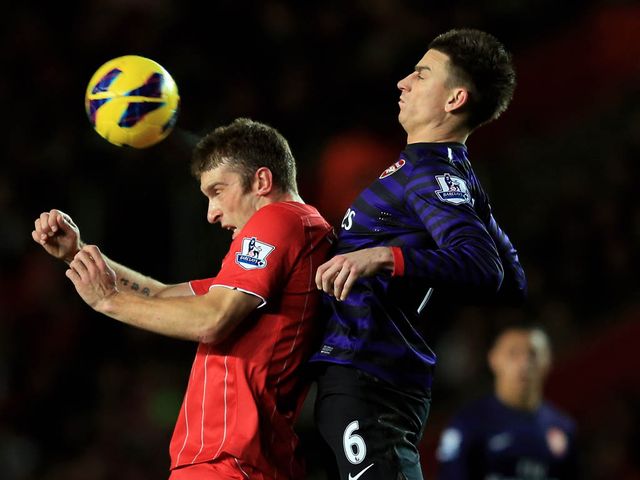 Rickie Lambert competes with Laurent Koscielny