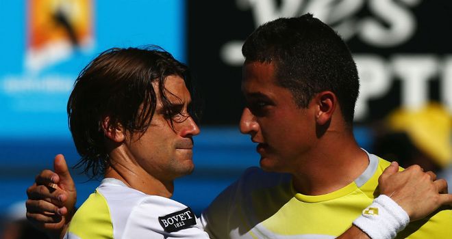 David Ferrer (L) and Nicolas Almagro (R) embrace after five-set thriller