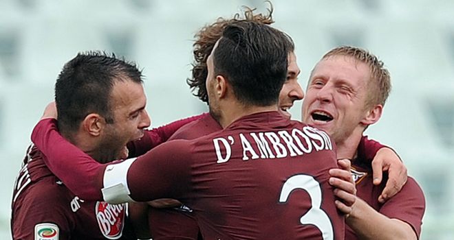 Alessio Cerci is mobbed after scoring