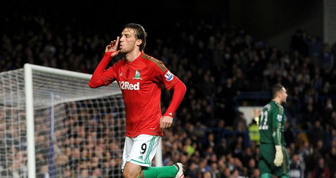 Michu: Celebrates his opener on an unforgettable night for Swansea at Stamford Bridge
