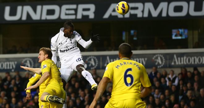 Emmanuel Adebayor heads Tottenham into the lead against Reading