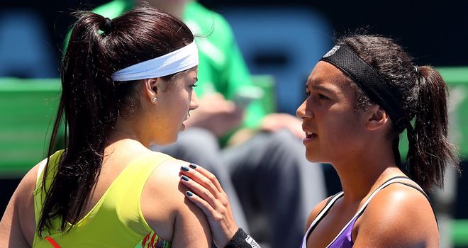 Heather Watson consoles Sorana Cirstea after the Romanian withdrew with illness