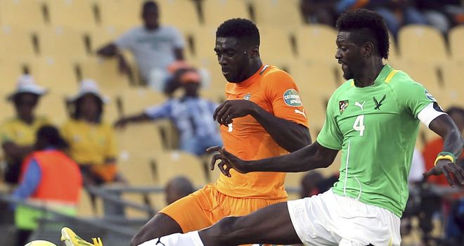 Emmanuel Adebayor and Kolo Toure: Battle for possession in tight contest