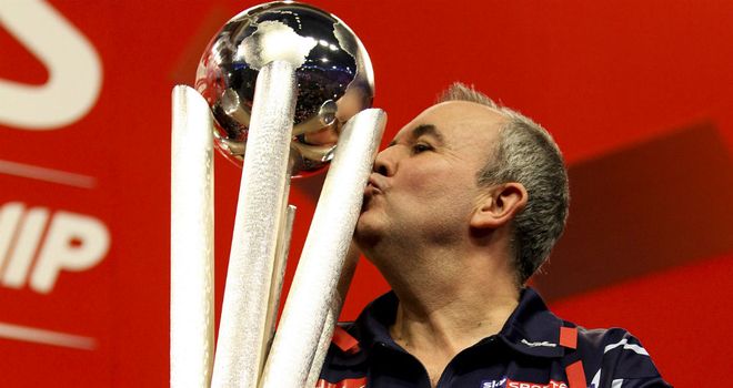 Phil Taylor: kisses the Sid Waddell Trophy after collecting his 16th world title