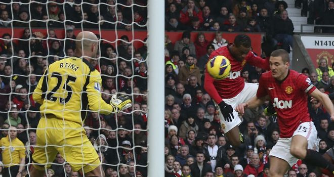 United go 2-0 up when Evra's header deflects in off captain Nemanja Vidic