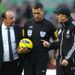 Benitez and Pulis are involved in a heated discussion at half-time