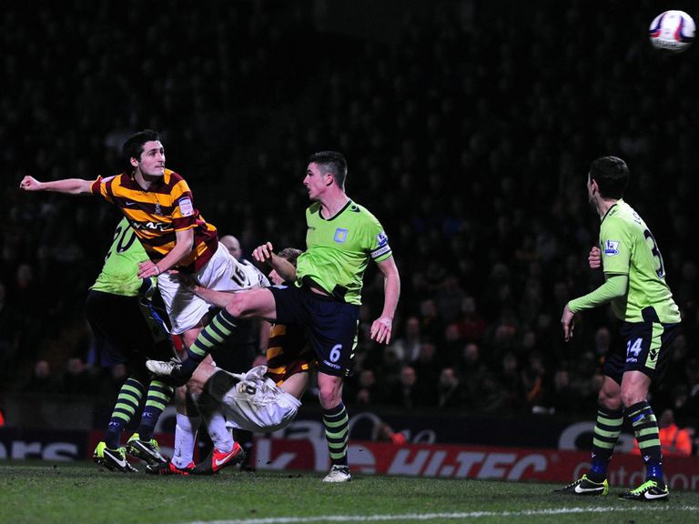 Carl McHugh heads home Bradford's third goal