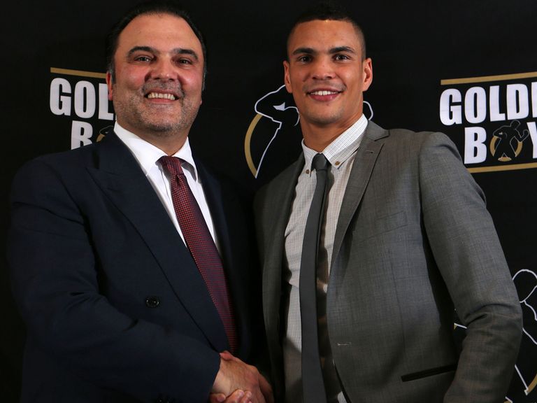 Anthony Ogogo (r) is welcomed by Golden Boy's Richard Schaefer