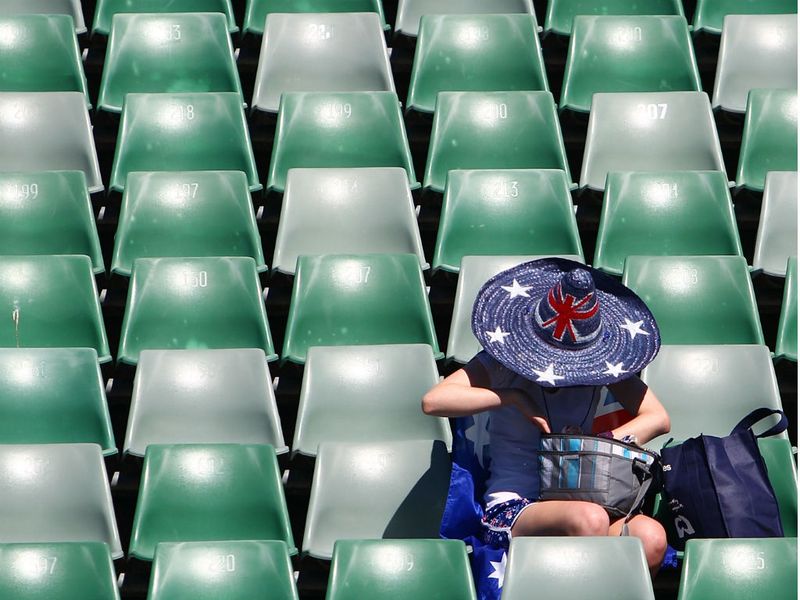 One fan makes sure she gets a good seat ahead of play on day two of the Australian Open