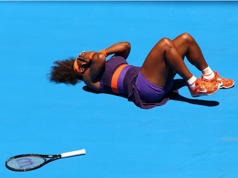 Serena Williams collapses in agony after turning her ankle