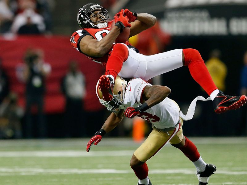 Roddy White gets upended taking a catch