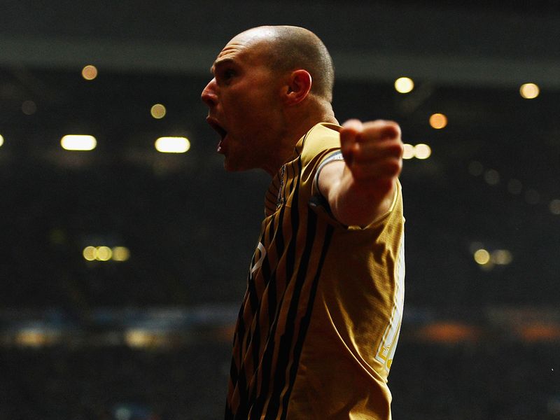 Gary Jones, who took the corner which led to Hanson's headed goal, celebrates in front of the travelling supporters