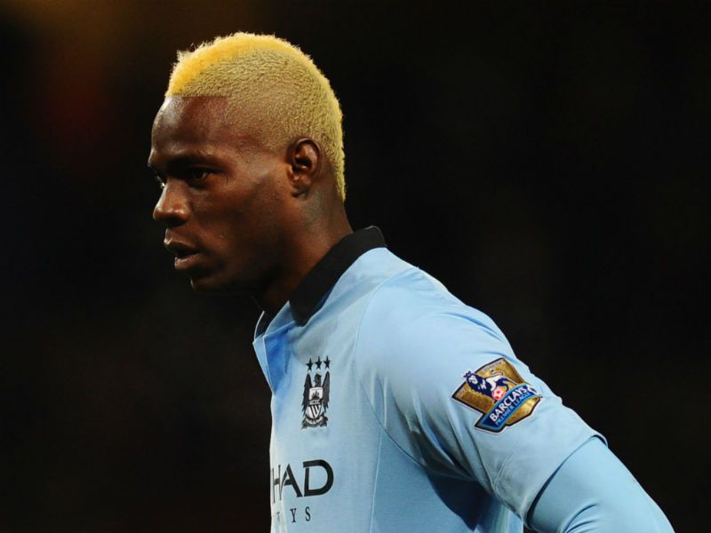 Mario Balotelli: The Manchester City substitute shows off his new hair do at the Emirates