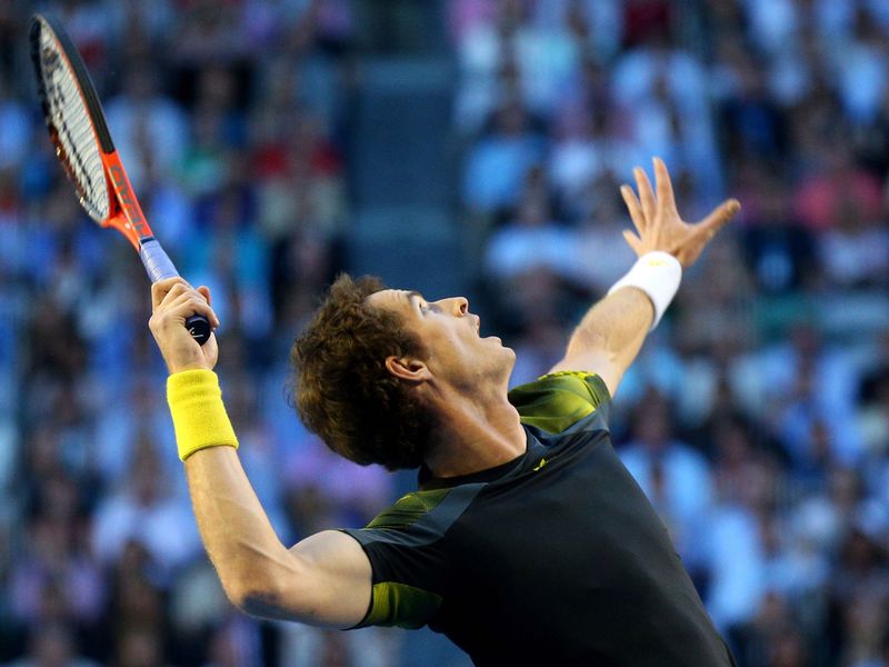 Fully focused: Murray serves during the match