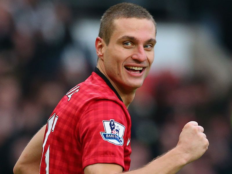 ...Vidic celebrates scoring the goal