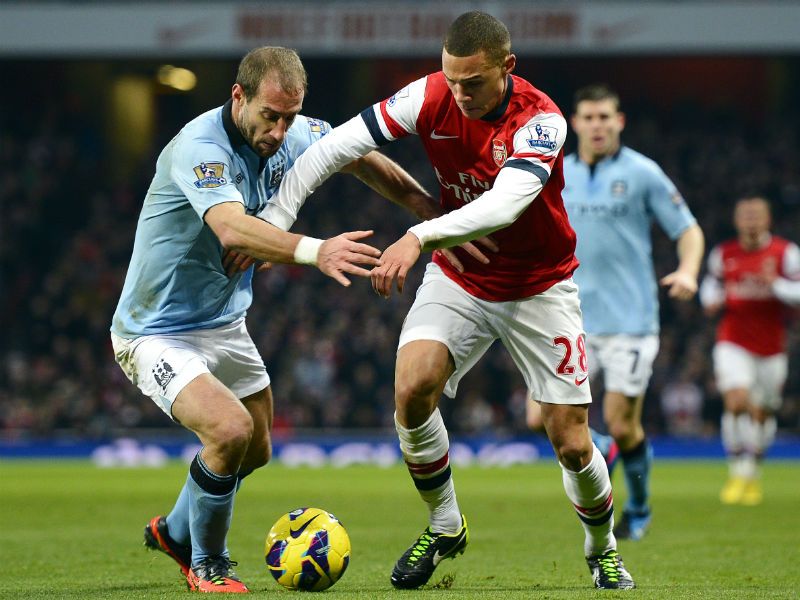 Fully committed: Pablo Zabaleta vies with Kieran Gibbs