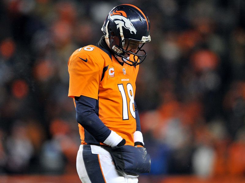 Peyton Manning threw an interception in overtime as the Broncos suffered a stunning loss to the Ravens