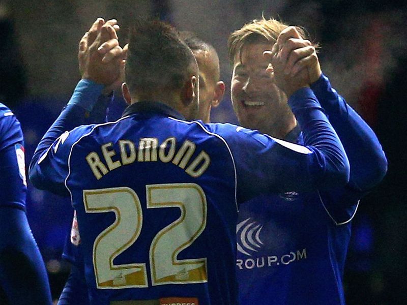 Wade Elliott celebrates his goal against Leeds with teammate Nathan Redmond at St Andrews