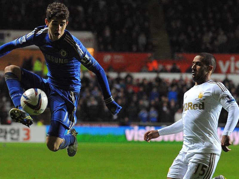 Wayne Routledge looks on as Chelsea's Oscar controls the ball, with the Blues continuing to apply the pressure.