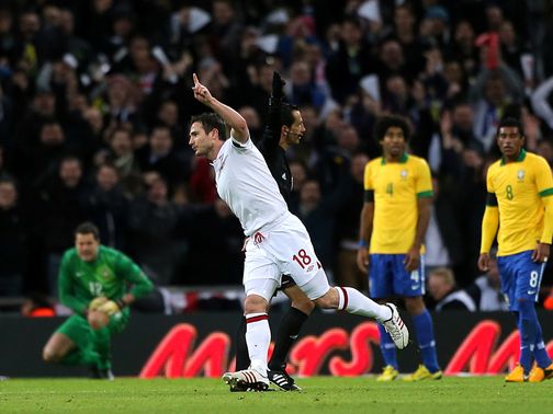 Frank Lampard celebrates his winner against Brazil